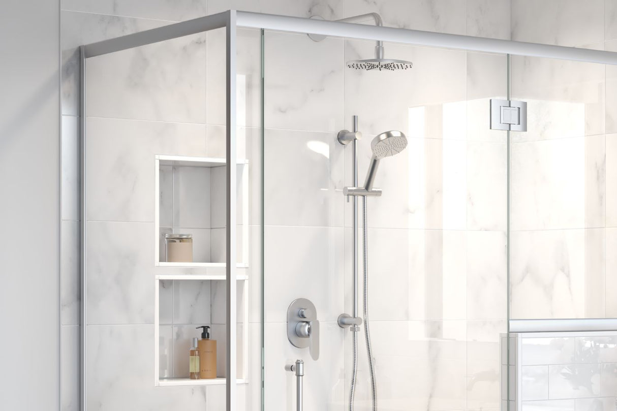 A standing shower with a two small shower niches stacked on top of each other holding body scrub, shampoo and conditioner.