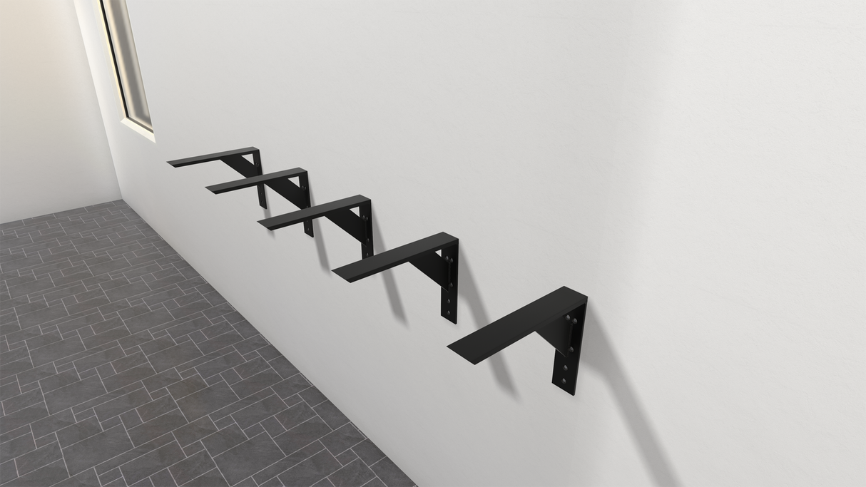 5 black large shelf brackets attached to a white wall with a gray tiled floor and window in the background.