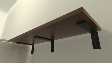 Underview of a dark brown wooden shelf held in place by three Regular Wood Shelf Brackets against a white wall.